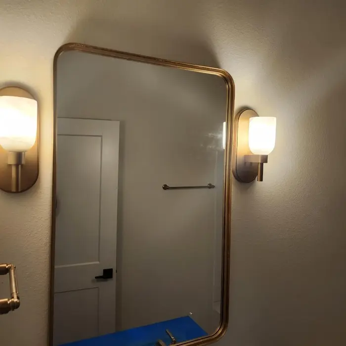 Wall sconces installed beside a bathroom mirror